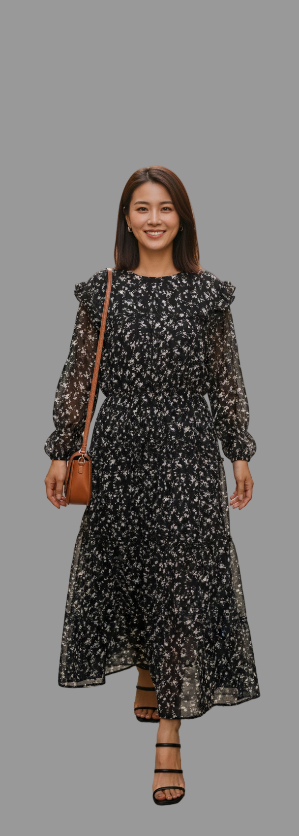 Woman in a floral dress walking down a street in an urban setting